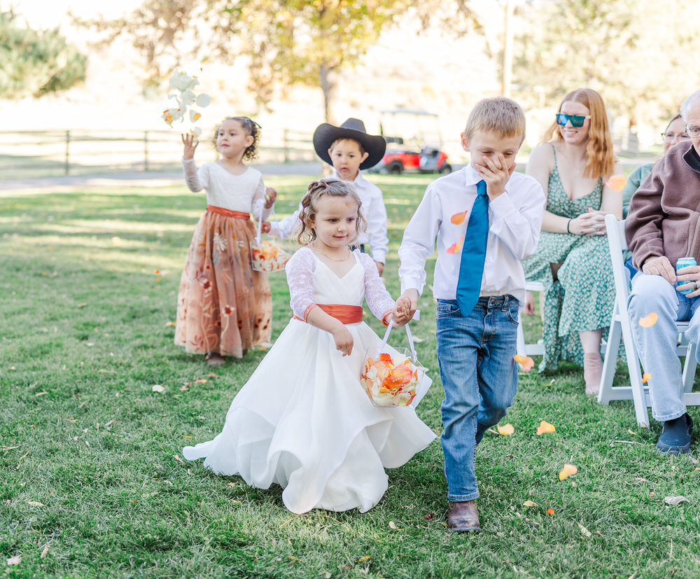 Flower girl throwing flowers 