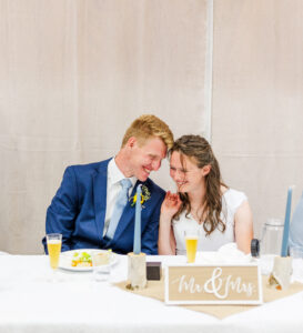 bride and groom smiling