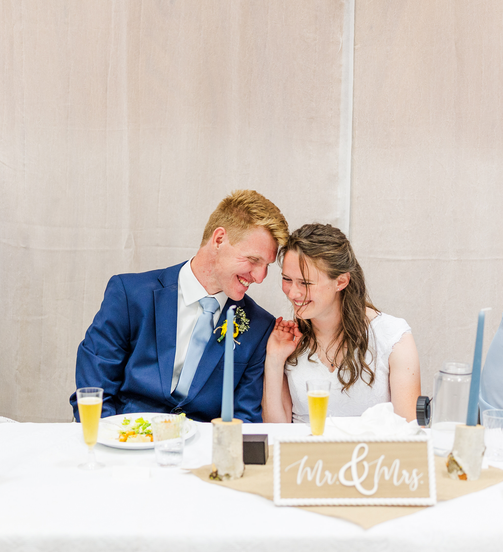 bride and groom smiling