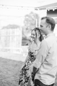 friend laughing at wedding 