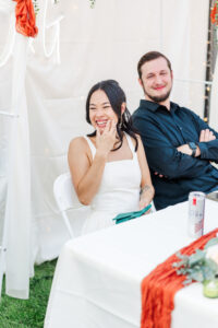 bride and groom laughing during speech after elko courthouse wedding 