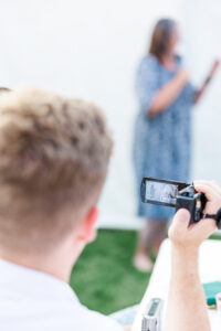 friend taking a video of speech 