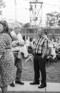 friends chatting at wedding
