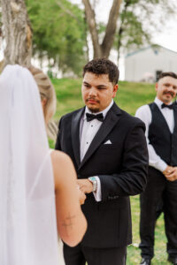 groom looking at bride