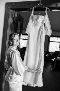 bride looking at her wedding dress 