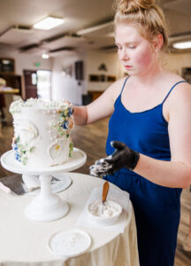 Elyssa decorating her cake