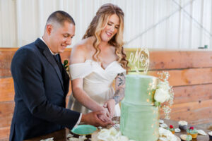 A bride and groom cutting their wedding cake at the elko NV venue, 7th Canyon Ranch 