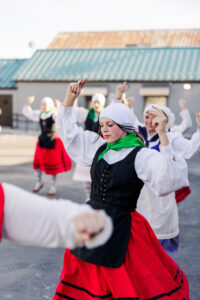 girl waving her hand in the air