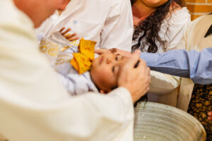 boy getting baptized 
