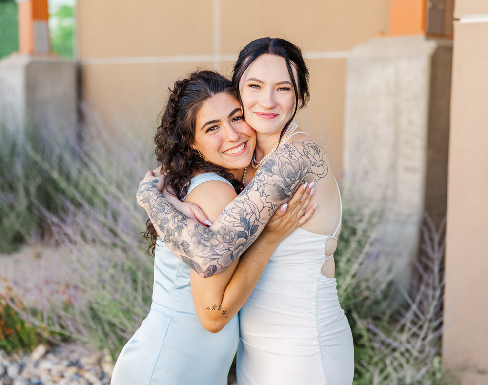 Elko Conference Center friends hugging a lot