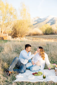 a mom and dad feeding each other 