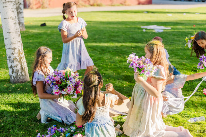 girls playing with flowers