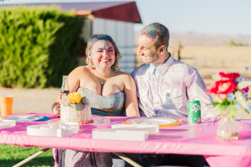 bride and groom laughing at toasts