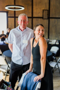 women and man smiling