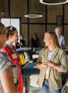 women talking and laughing