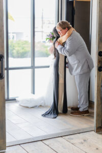 groom hugging mom