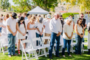Everyone praying at Maggie Creek Ranch