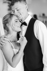 Bride and brother hugging at sand and sagebrush, the perfect bridal suite before heading to your Wedding Venue in Elko Nevada 