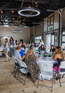 People eating at The Elko NV Wedding Venue, The Lostra Warehouse
