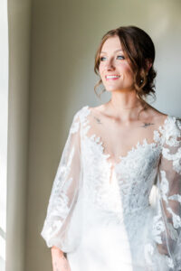 Bride looking out the window at the Old Schoolhouse