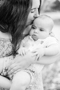 mom kissing baby