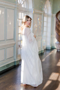 woman looking at me holding her baby 