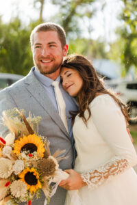 Bride laying on groom's shoulder 