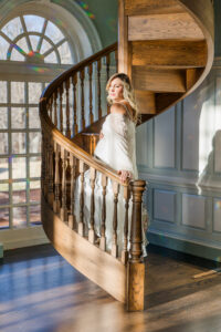 A pregnant woman walking up stairs 