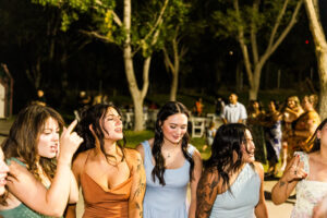 bridal party singing and dancing