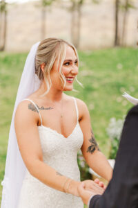 bride holding grooms hand