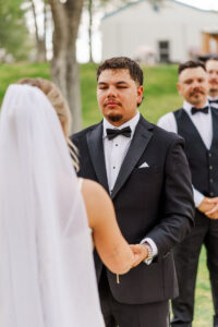 groom holding brides hand