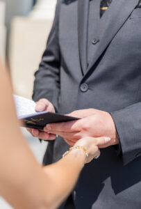 bride holding grooms hand 