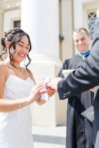bride putting on ring for my wedding portfolio 