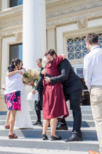 groom hugging grandma 