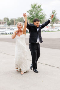 bride and groom cheering