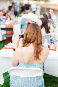 girl capturing wedding on video camera 