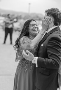 mom and groom laughing