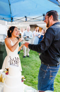 bride feeding groom cake 