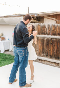 bride smiling at groom 