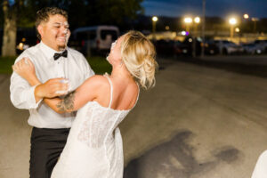 the bride and groom laughing
