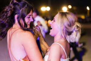 bride dancing with friend