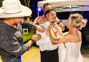 groom taking off shirt