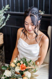 bride looking at her flowers 
